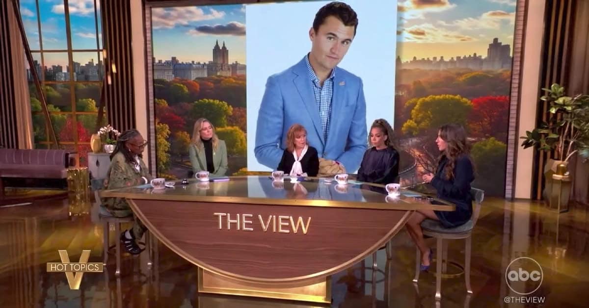 Young man in a blue blazer featured on The View discussing news and current events on America Out Loud News.
