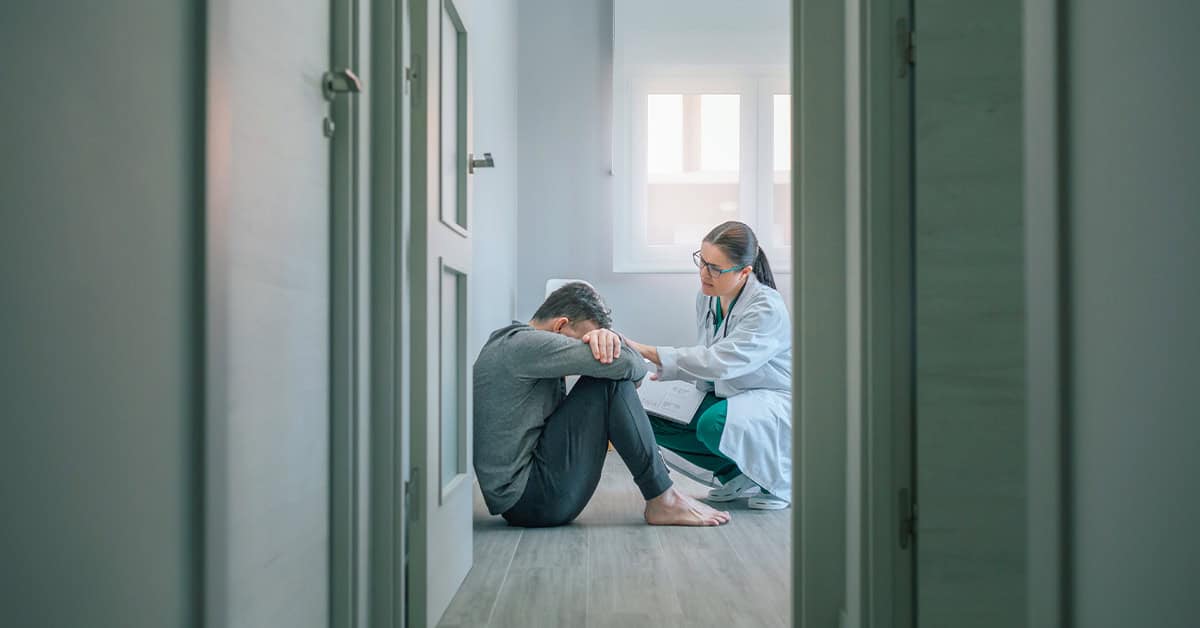 Feeling distressed patient talking to doctor in a healthcare clinic, emotional support, mental health counseling, healthcare, medical consultation, emotional distress, patient care, doctor and patient relationship, mental health awareness, healthcare support.