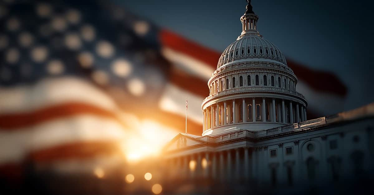 Sunset behind the U.S. Capitol with waving American flag, symbolizing patriotic news coverage from America Out Loud News.
