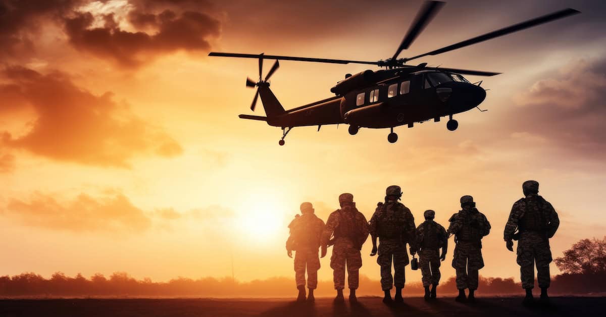 Military personnel walking towards a helicopter at sunset, symbolizing defense, homeland security, and military operations.
