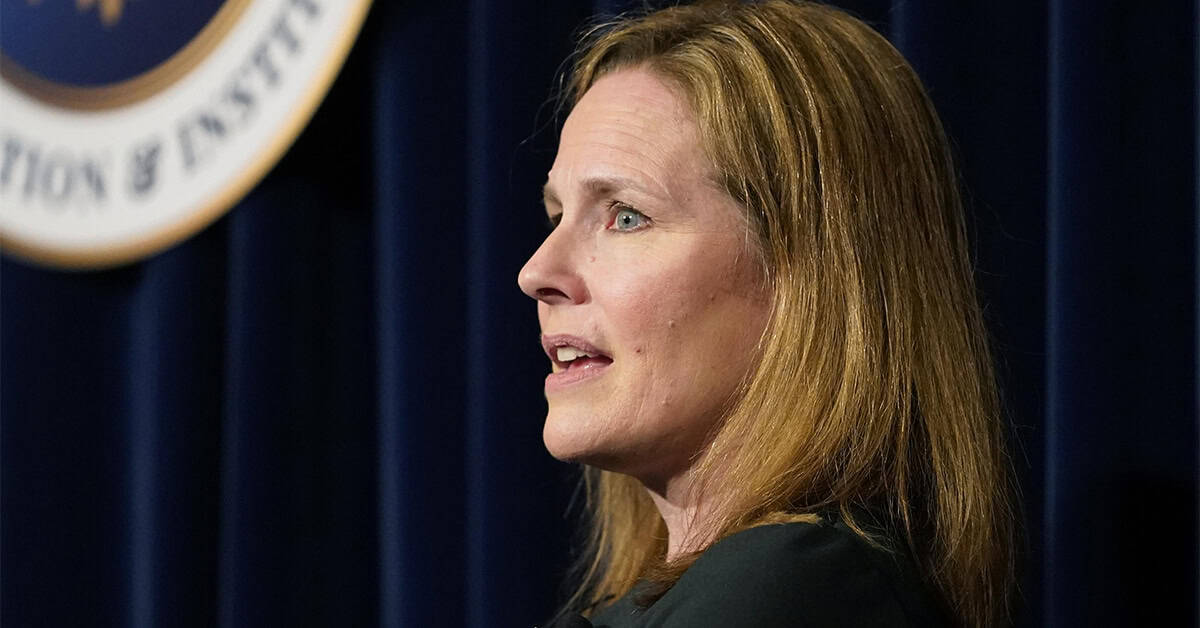 Senator speaking at a press conference with America Out Loud News coverage, emphasizing conservative political viewpoints and current national issues.
