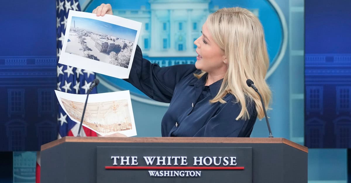 White House press secretary Karoline Leavitt holds up photos of the planned new White House ballroom during a press briefing at the White House