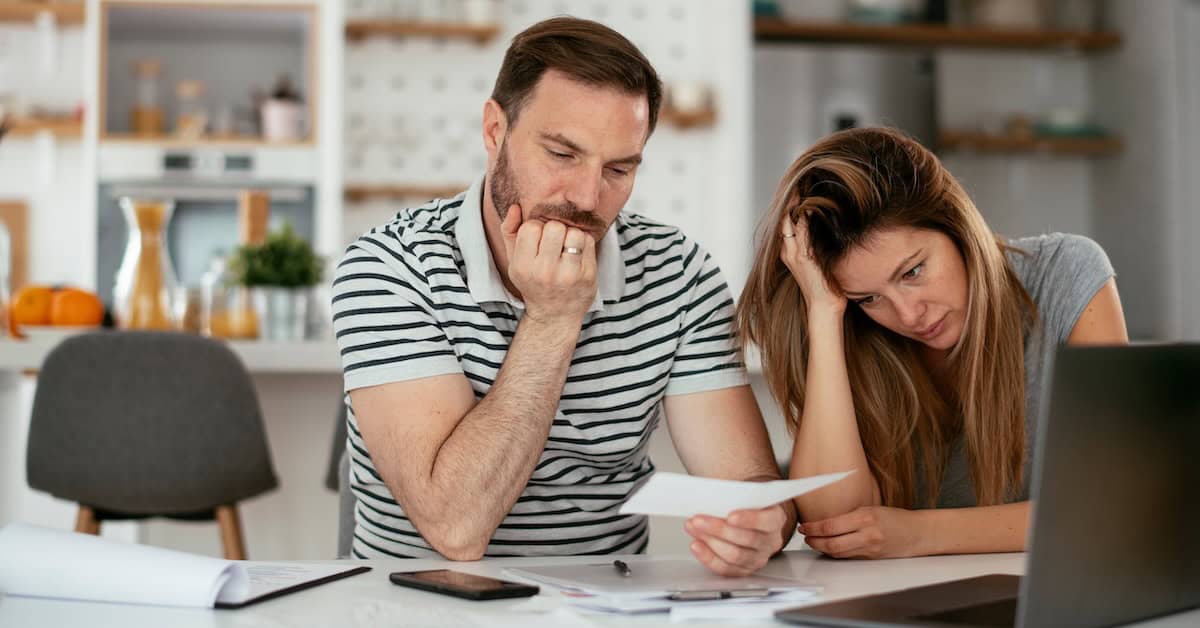 Husband and wife preparing bills to pay. Young couple having financial problems